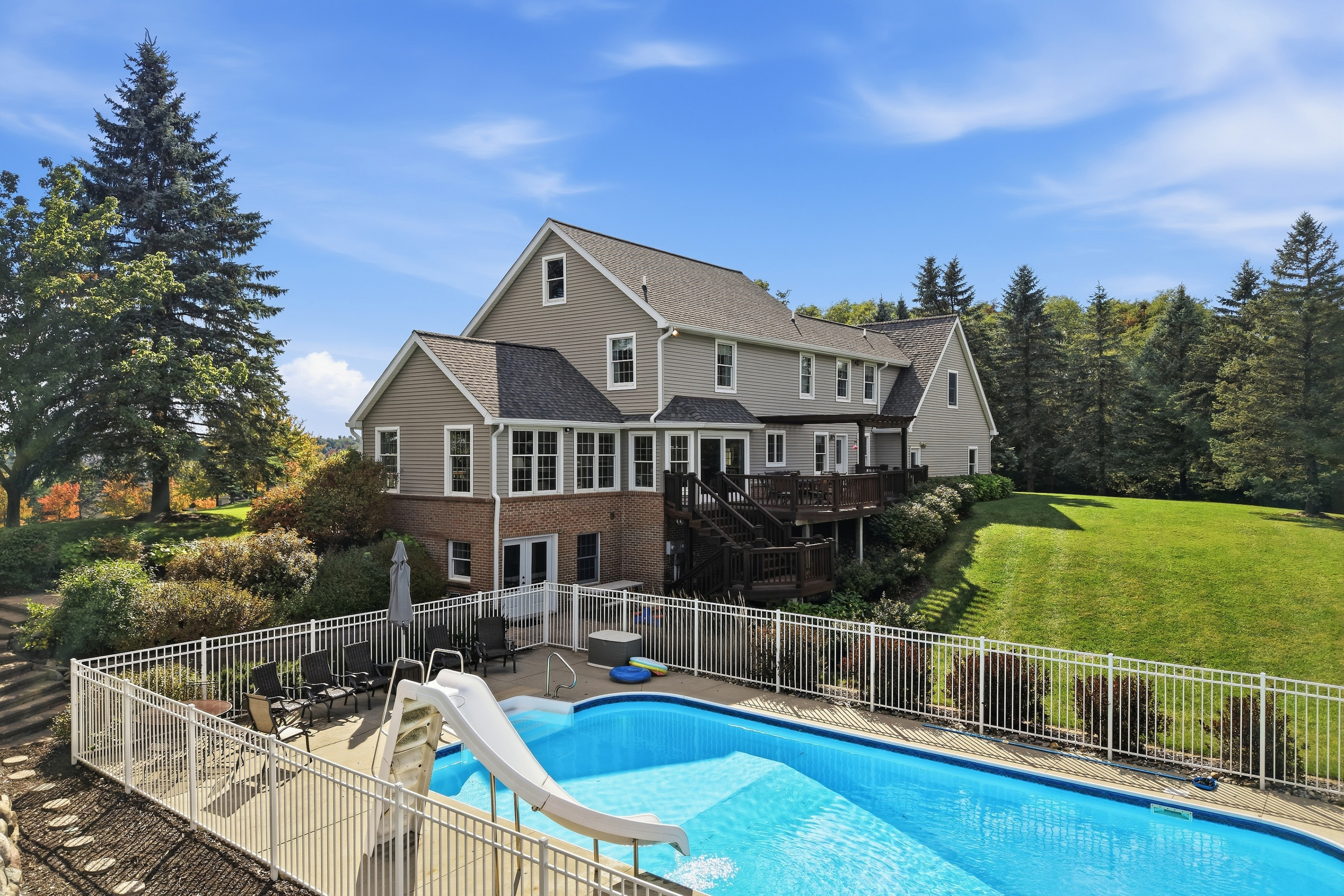 Rear elevation with in-ground pool and water slide